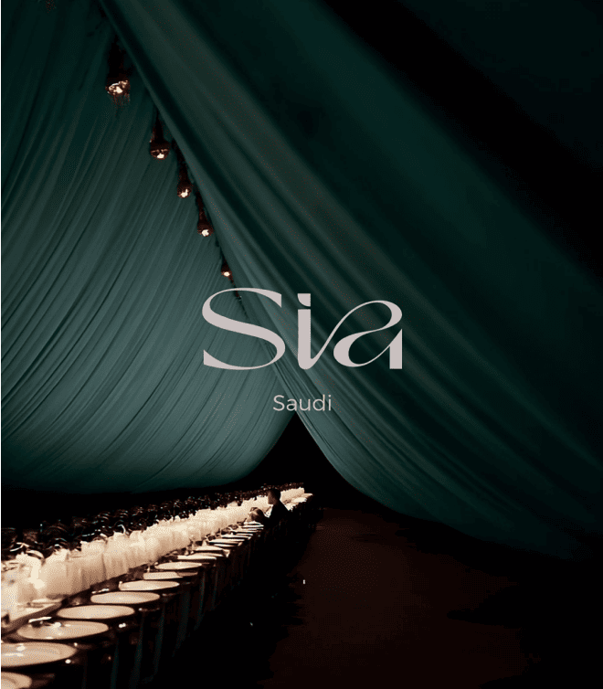 SIA logo over dark green draped fabric