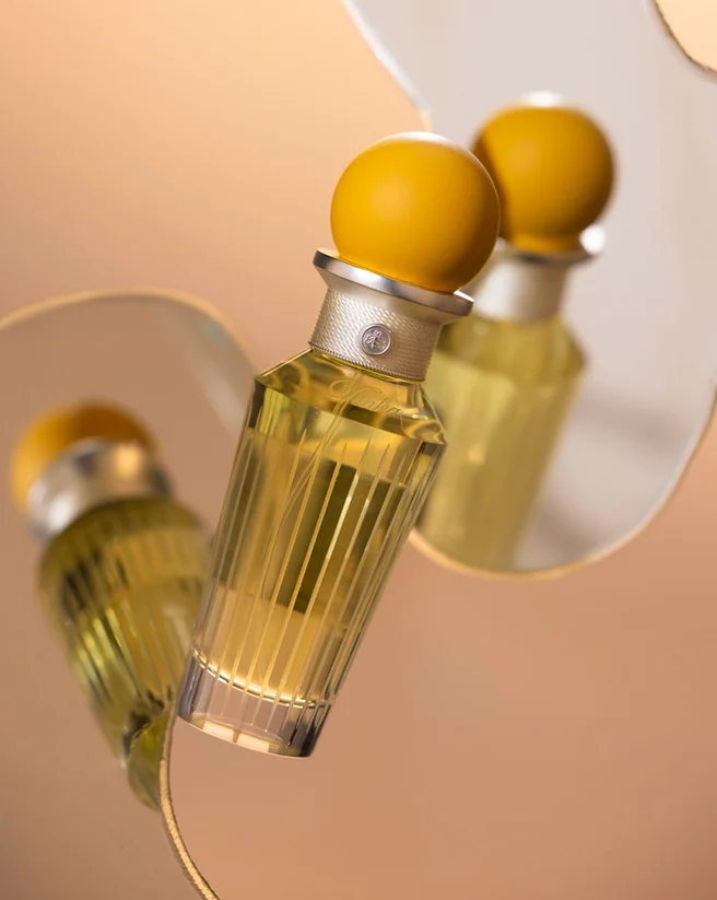 Zan fragrance bottle reflected in a mirror